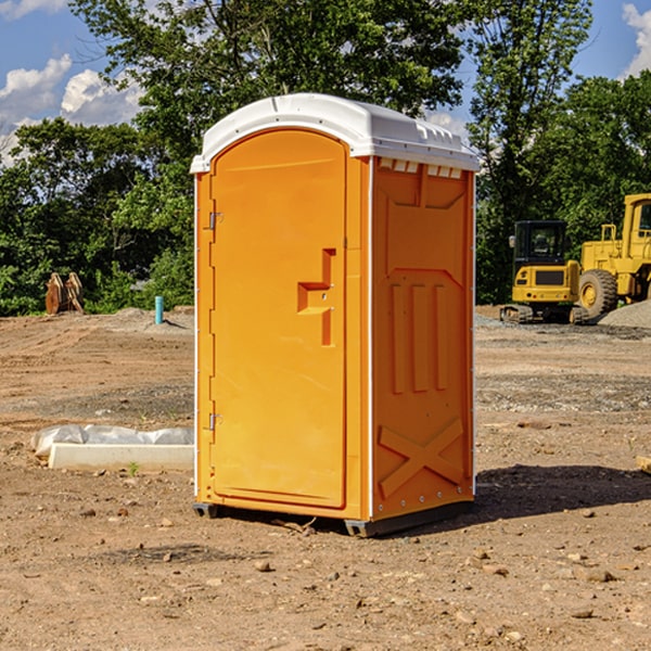 what is the cost difference between standard and deluxe portable restroom rentals in Alden